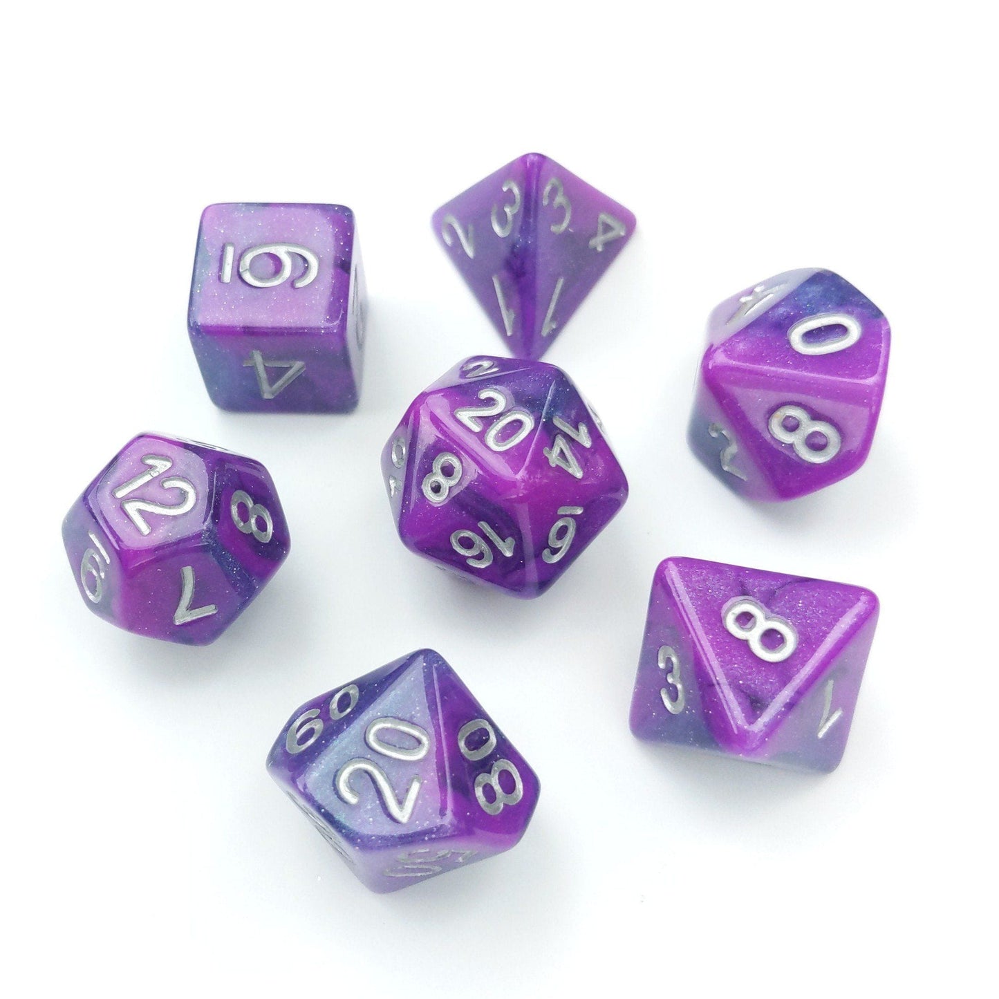 Marbled shimmering purple and blue Warlock Flames Dice Set with silver numbers for tabletop RPGs like Dungeons and Dragons.