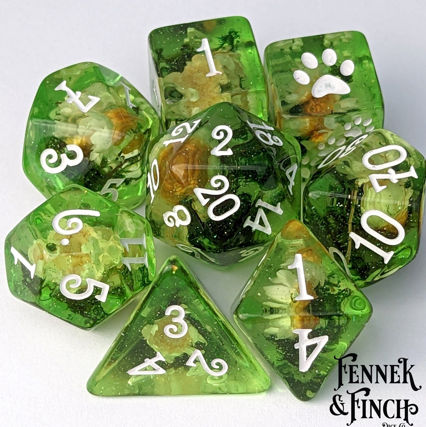 Green DnD dice set with real dried white flowers and moss inside, perfect for druid or flower enthusiasts.
