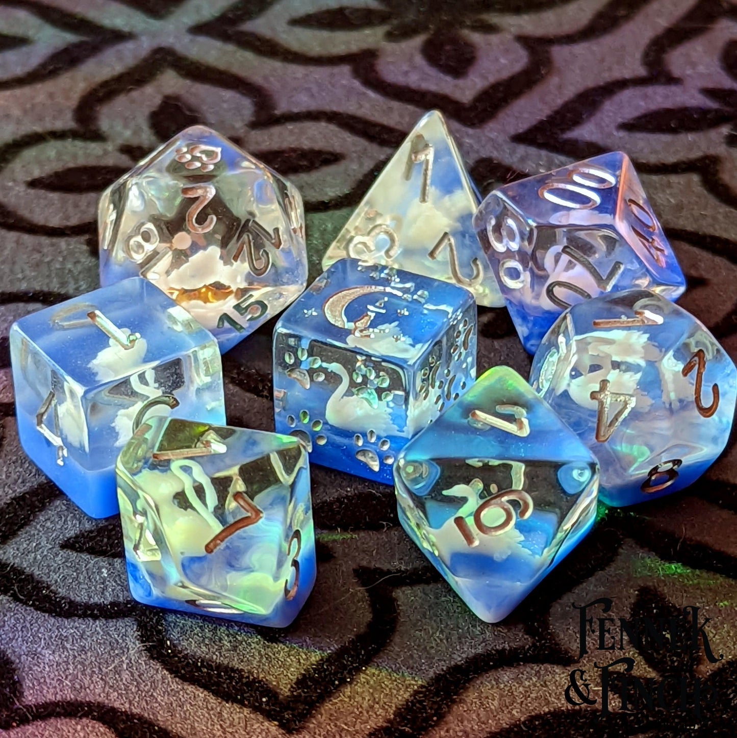 White Swan 8-piece DnD dice set with 3D-printed swans and custom cat wizard D6, on an intricate tabletop surface.