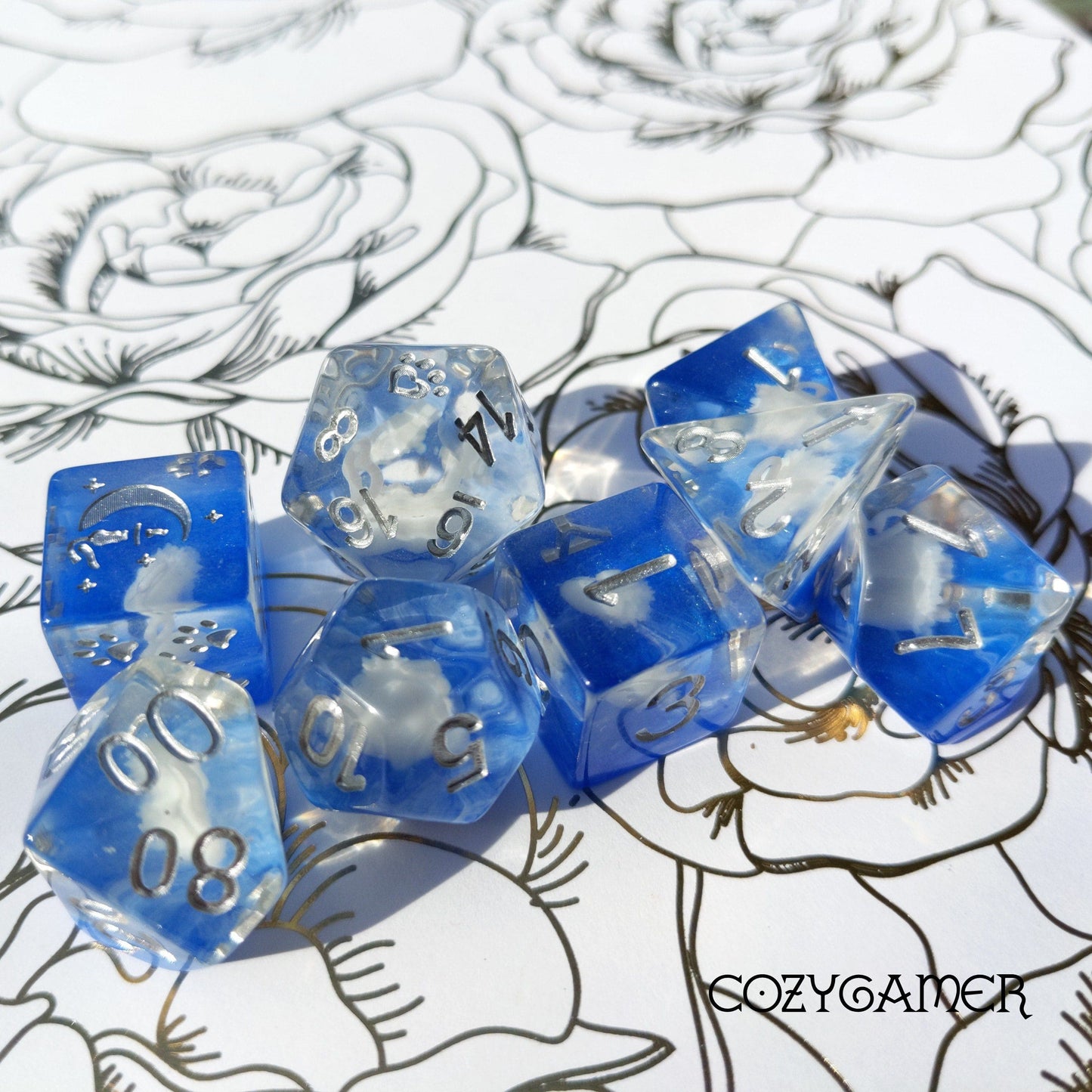 White Swan 8 Piece DnD Dice Set with 3D-printed swan design in blue resin on floral background, featuring custom cat wizard D6