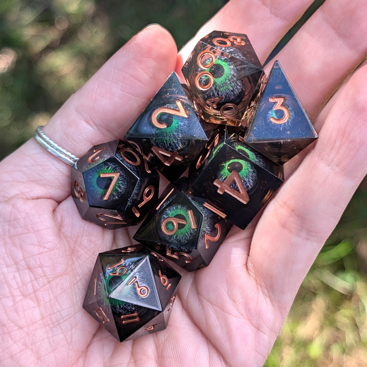 Moving Eye Liquid Core DnD Dice Set - Black & Green - The Hollow Gaze