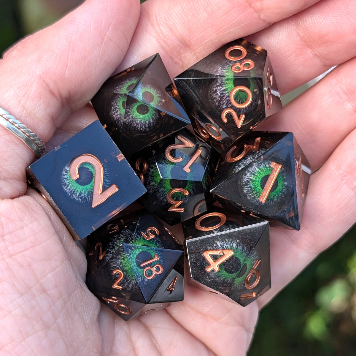 Moving Eye Liquid Core DnD Dice Set - Black & Green - The Hollow Gaze