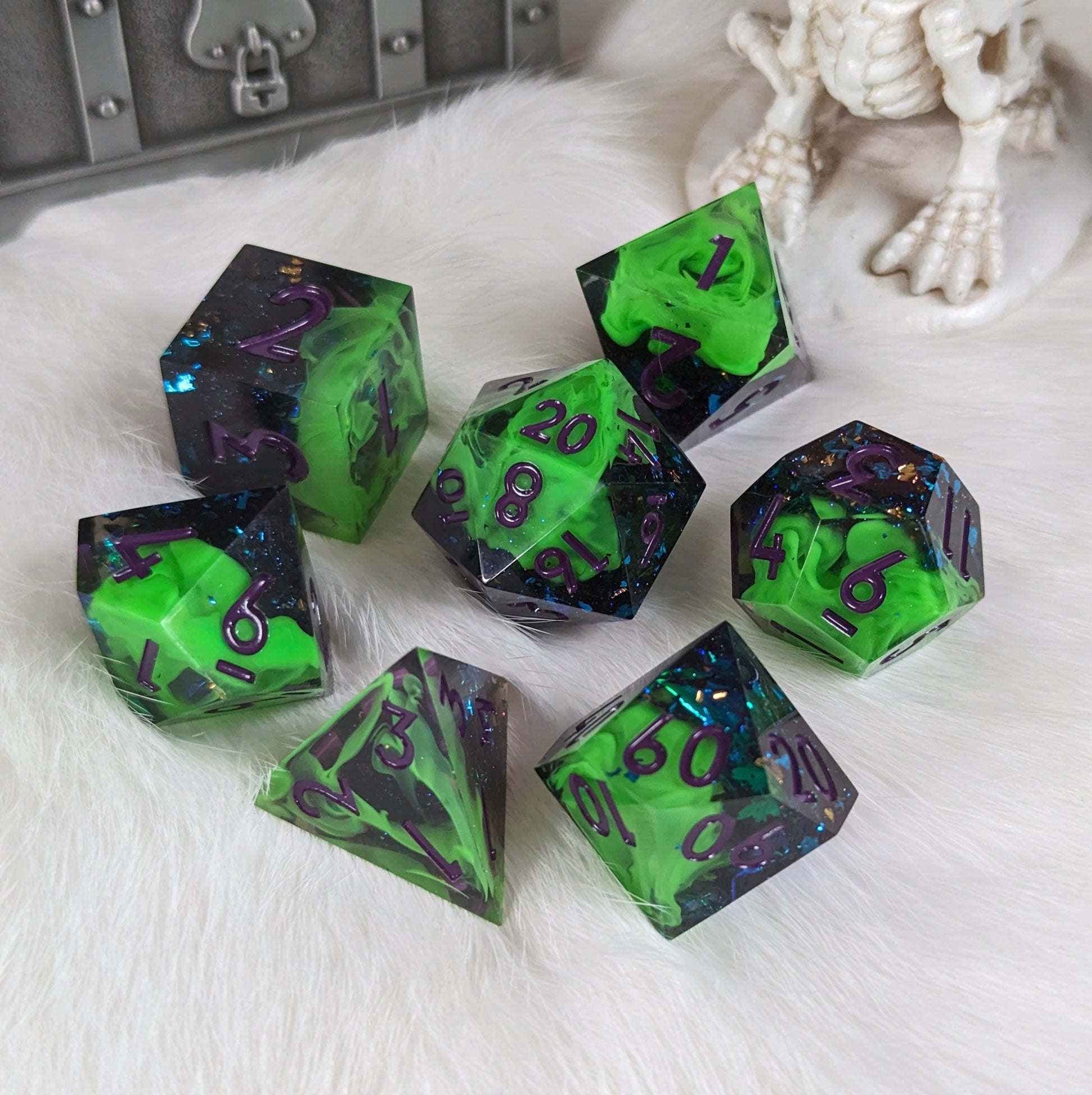 Neon green and black TTRPG dice set with sharp edges, layered design, and purple font on a white background.