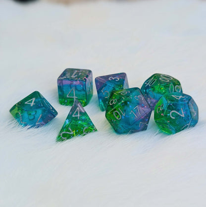 Aurora Sparkle Dice Set with green, blue, and purple layers and glitter flakes, perfect for adventurous tabletop games.