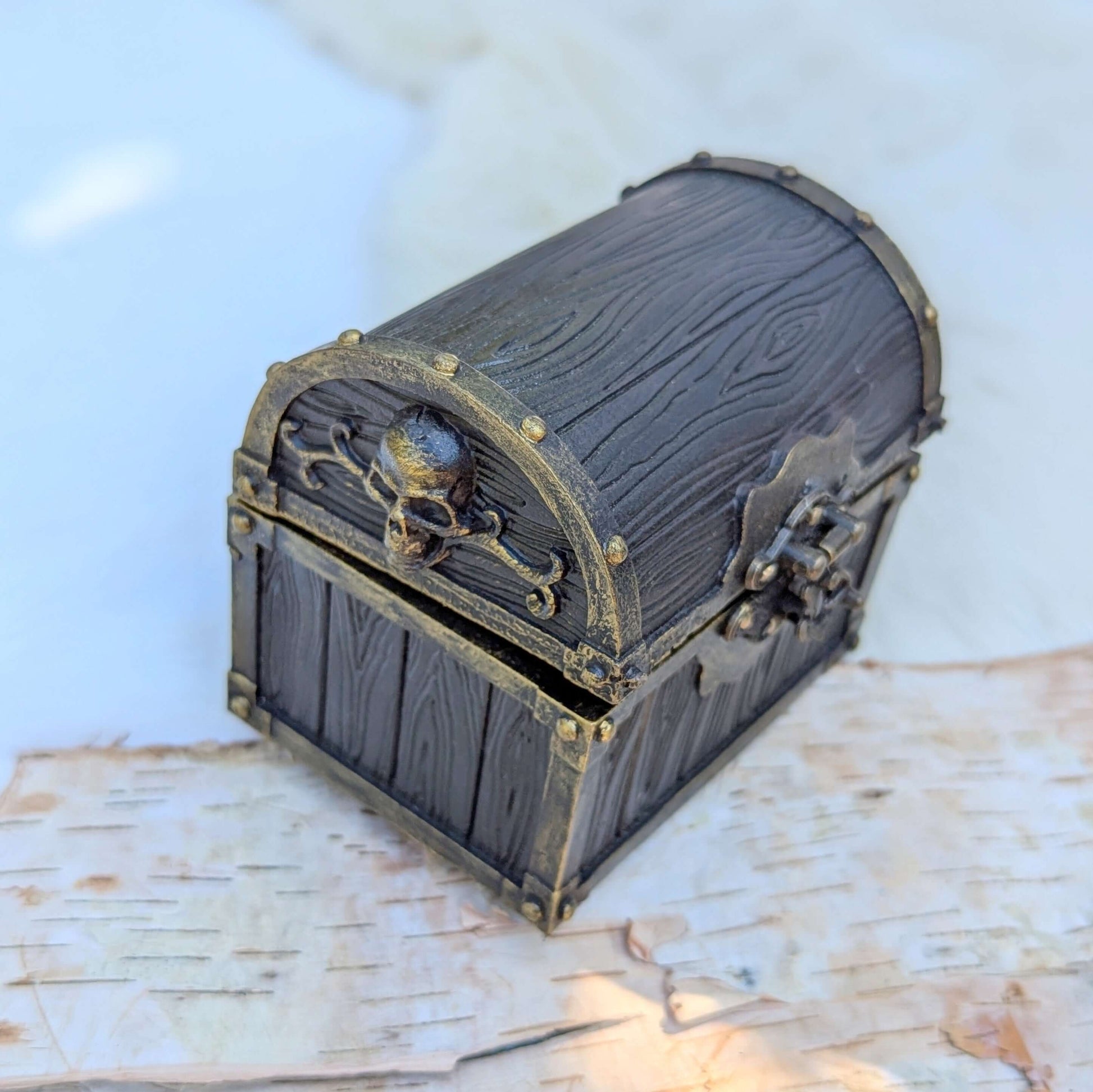 Mimic Treasure Chest Dice Box with wood and metal detailing, featuring a secure latch and skull embellishment.