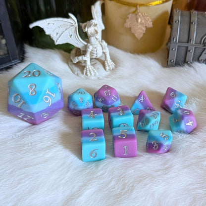 Twilight Serenity Large D20 dice set in teal, blue, purple hues with silver numbers on a white fur background