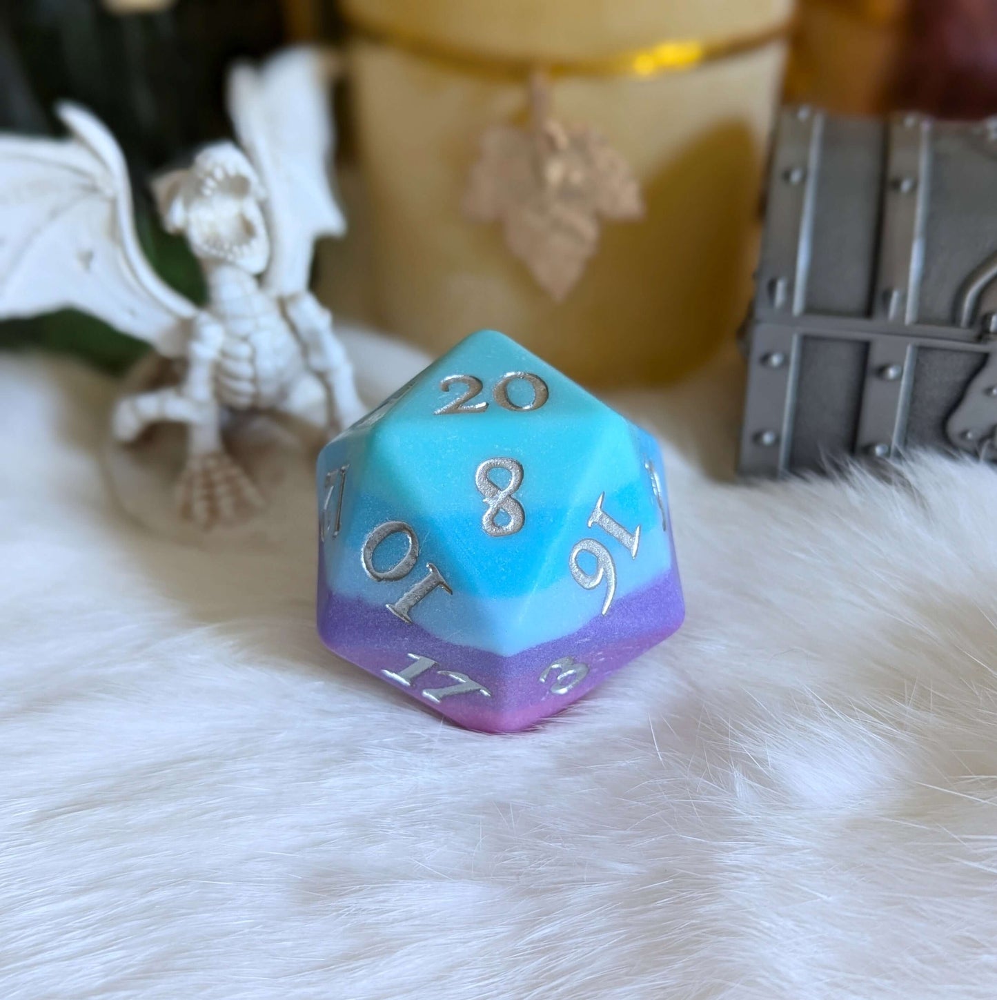 Twilight Serenity Large D20 with ombre teal to purple hues and silver numbers on a matte finish, set on a white fur surface.