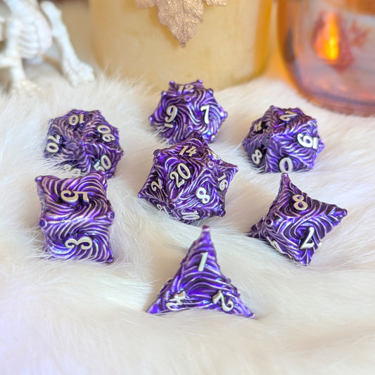 Purple Enchanted Bark Metal Dice Set with Silver Numbers on White Fur Background