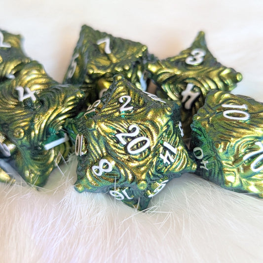 Enchanted Bark Metal Dice Set in Green with tree bark texture and white numbers, perfect for nature-loving RPG fans.