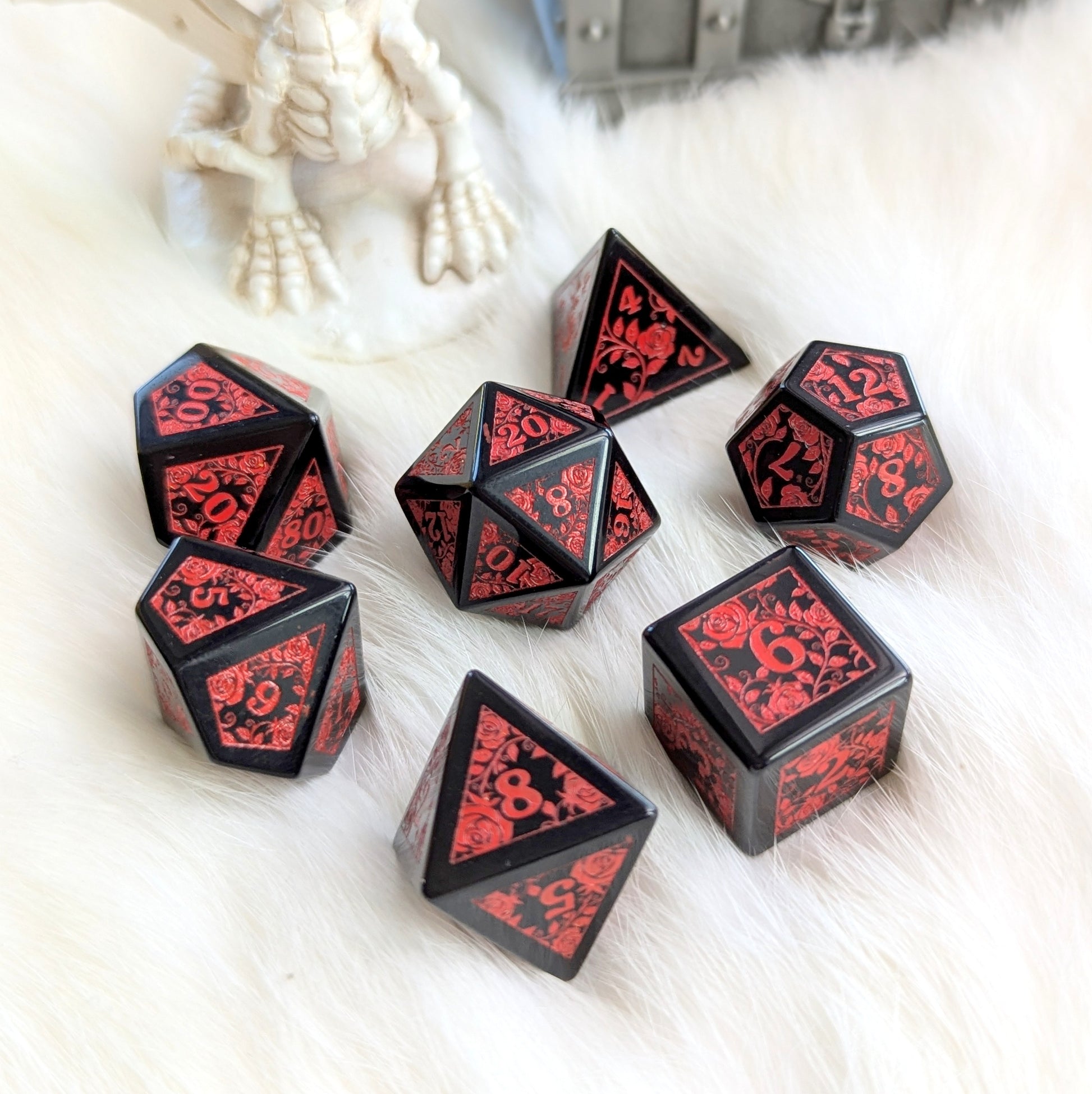 Obsidian Rose Vine Gemstone Dice Set with red engravings on fur background