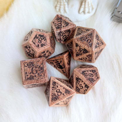 Rosewood Rose Vine Engraved Dice Set on white fur background