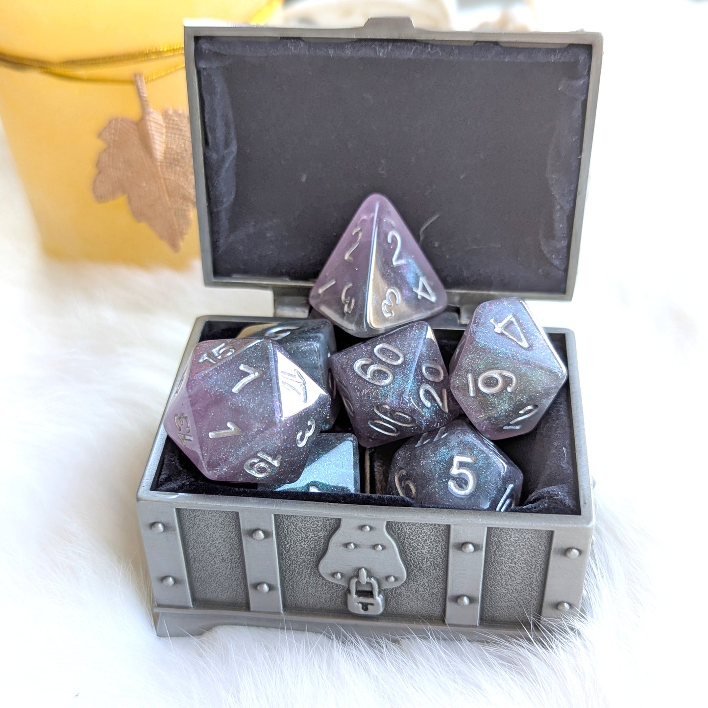 Shadow Veil Dice Set in Treasure Chest, shimmering grey with purple hints, round-edge resin, elegant silver numbers, 7-piece set.