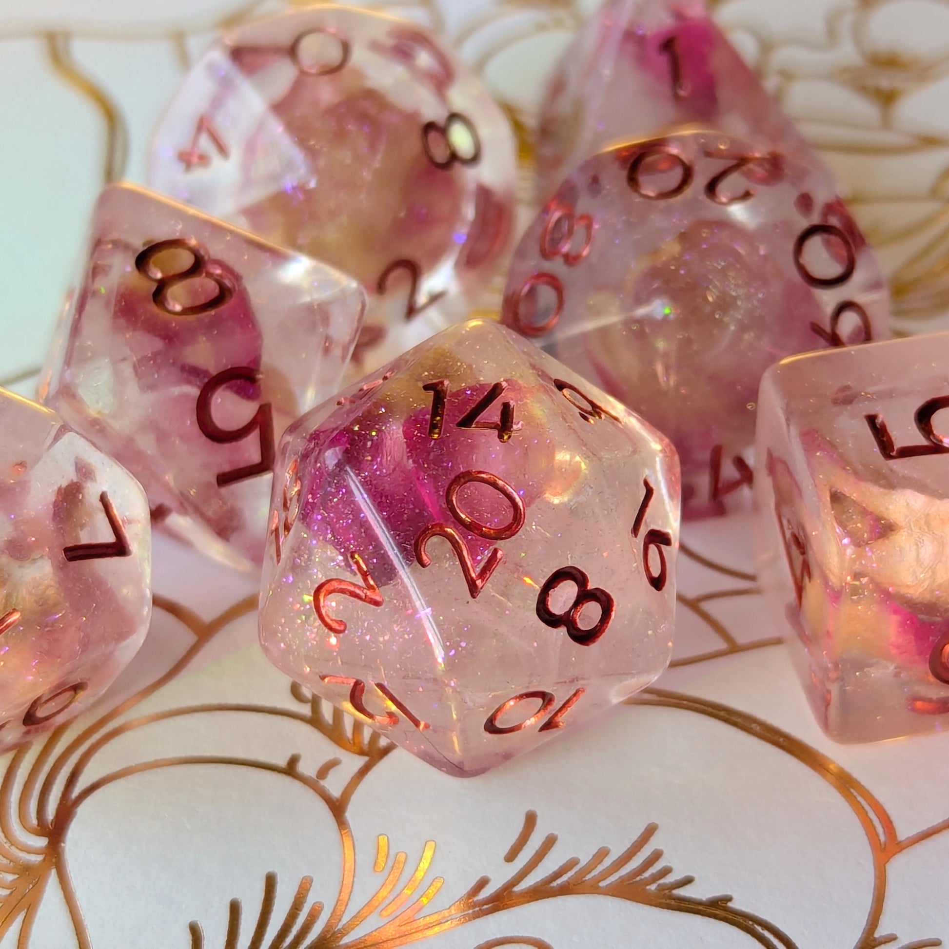 Eternal Rose Dice Set featuring deep pink petals in clear resin with metallic red numbers and sparkling glitter accents.