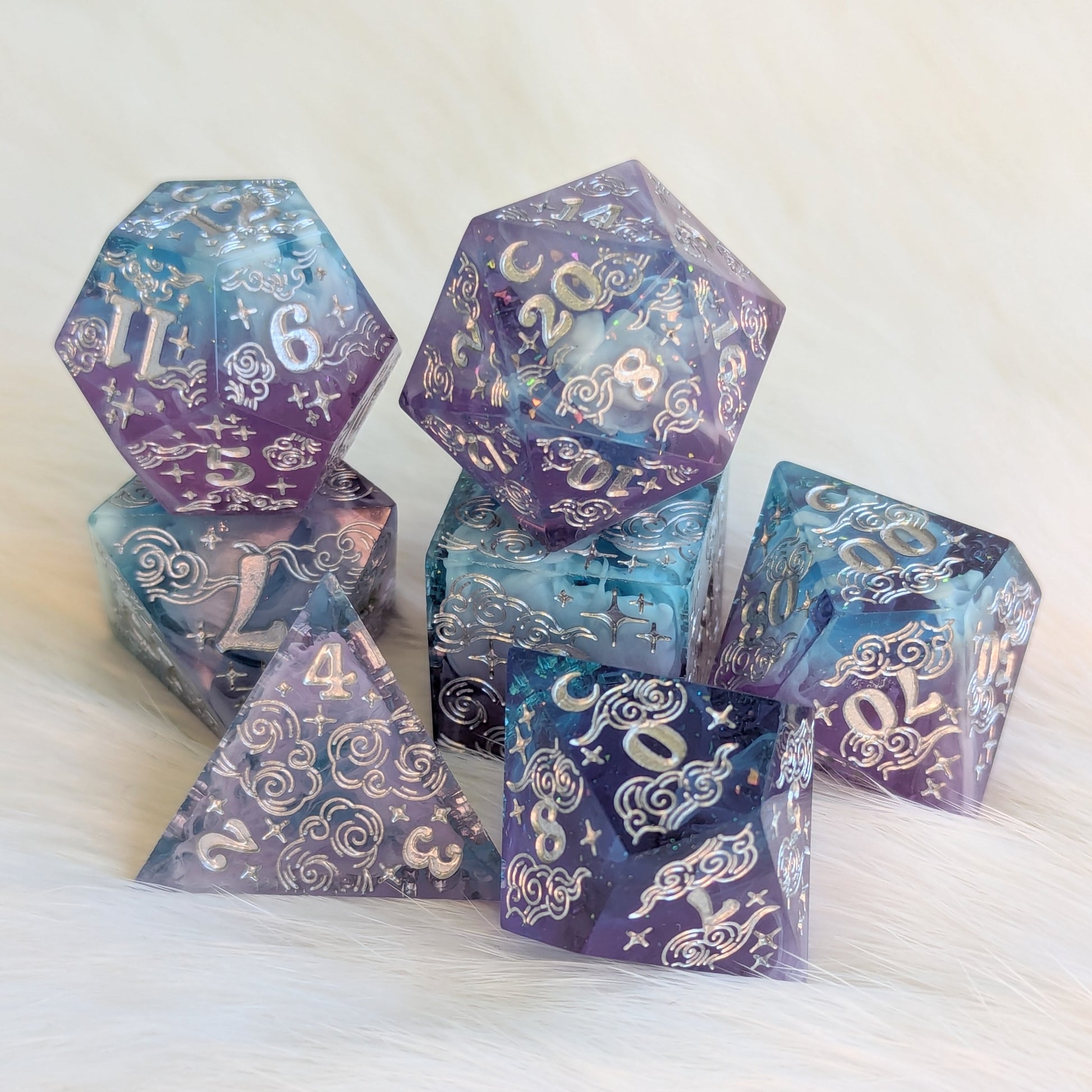 Dreamy Amethyst Sky sharp edge resin dice set featuring purple and blue layers with white clouds and glitter flakes.