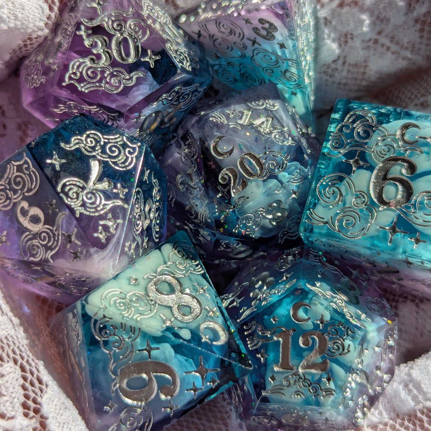 Dreamy Amethyst Sky sharp edge resin dice set featuring purple and blue crystals with cloud designs and glitter detailing.