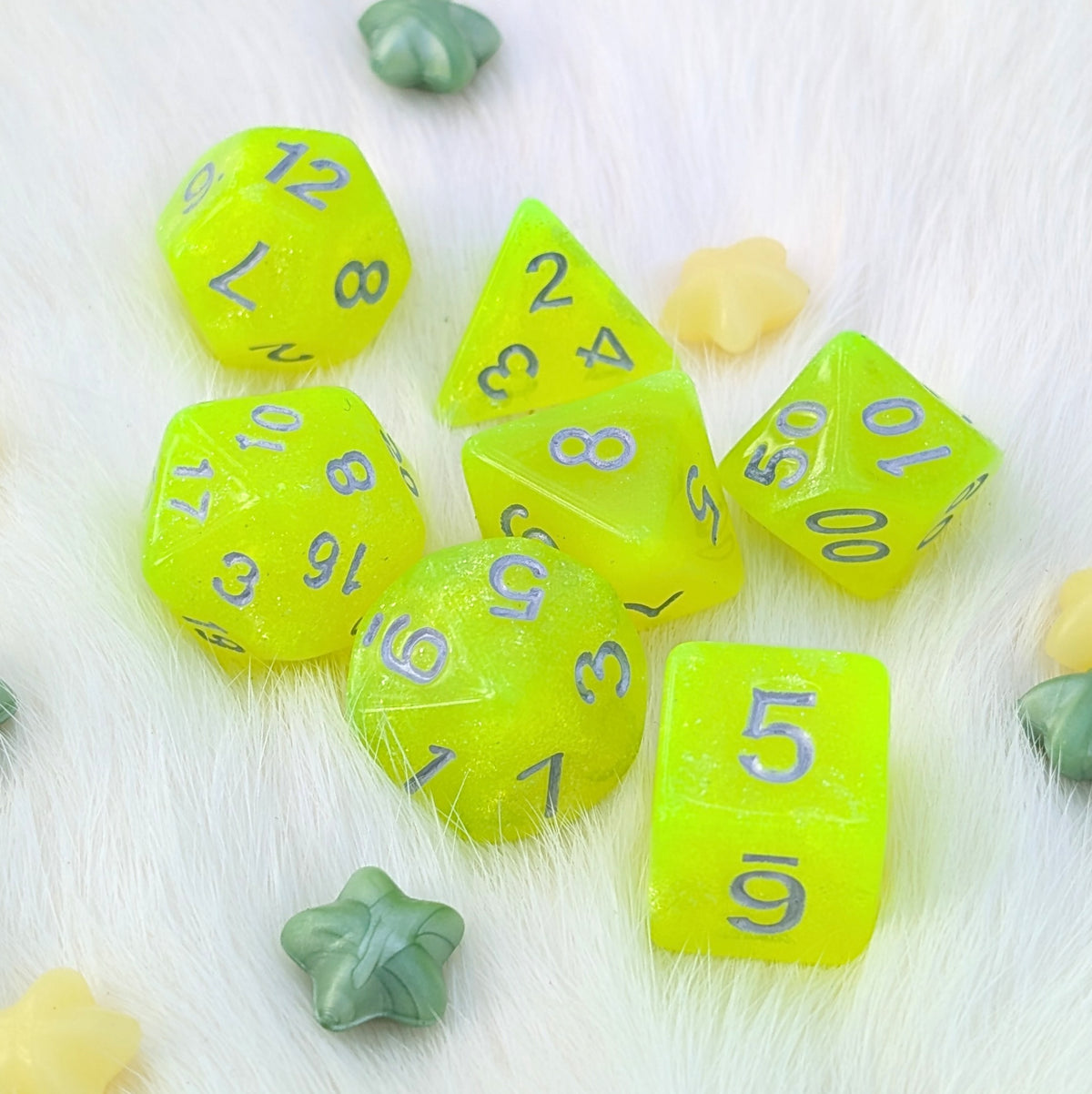 Toxic Sparkle 7-piece round-edge acrylic DnD dice set with sparkling neon yellow-green glitter and silver numbering