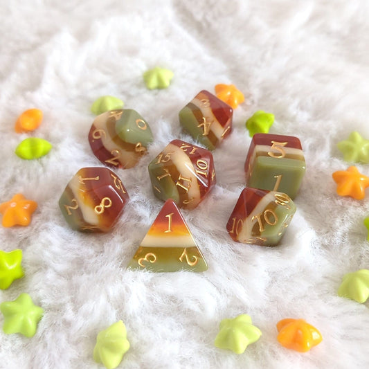 Autumn Arbor TTRPG Dice Set with autumn hues on a soft background, featuring olive green and auburn brown dice.