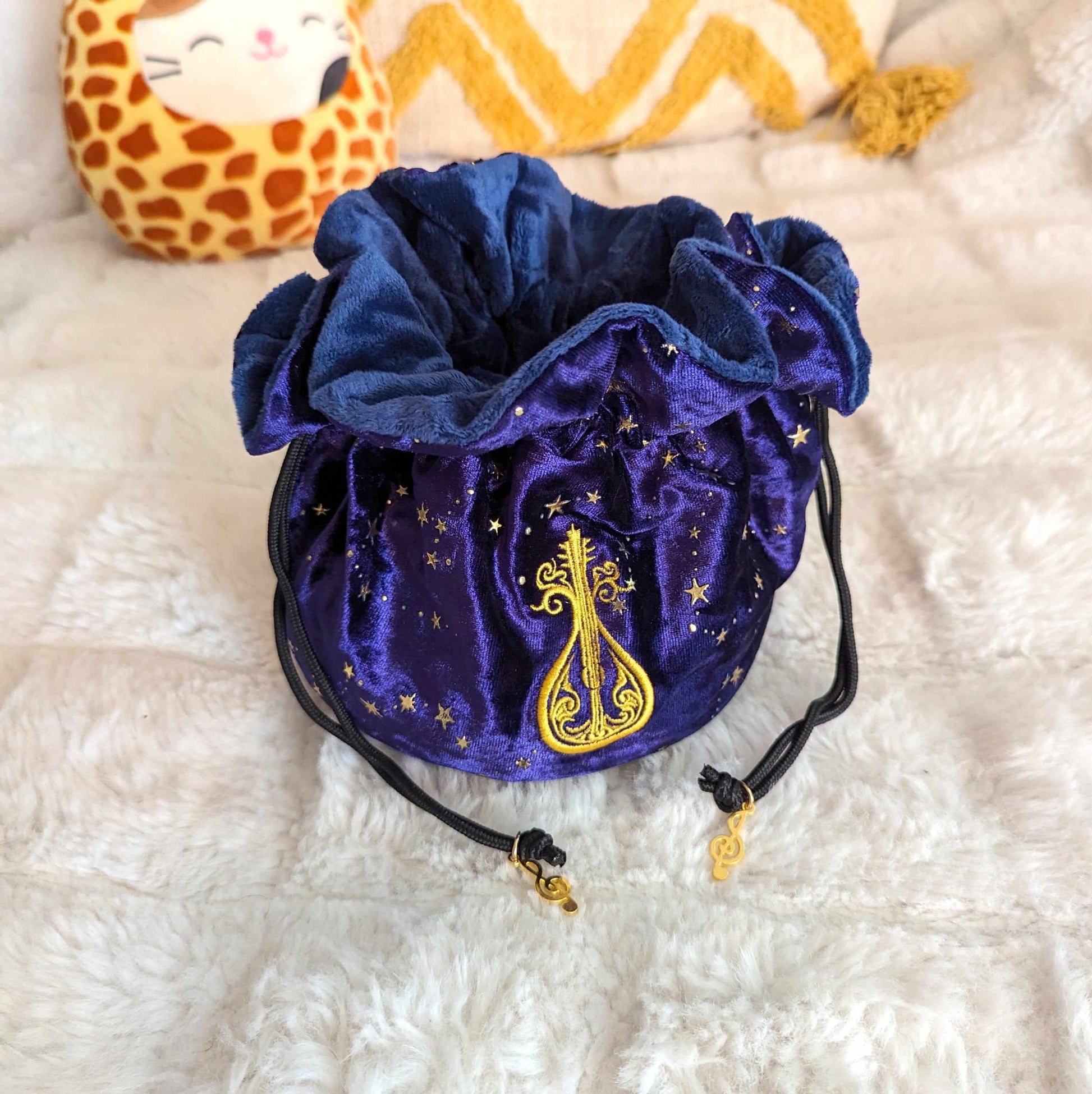 Bard multi pocket dice bag in starry purple velvet with embroidered lute design and musical charms, 9x4.5 inches, cozy dice storage.