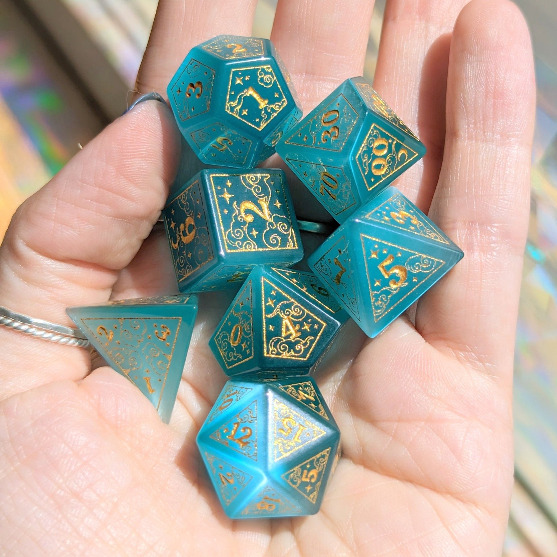 Dreamy Blue Cat's Eye Glass Dice Set – 7 - Piece Celestial DnD Dice with Gold Symbols | Fennek & Finch - Fennek and Finch