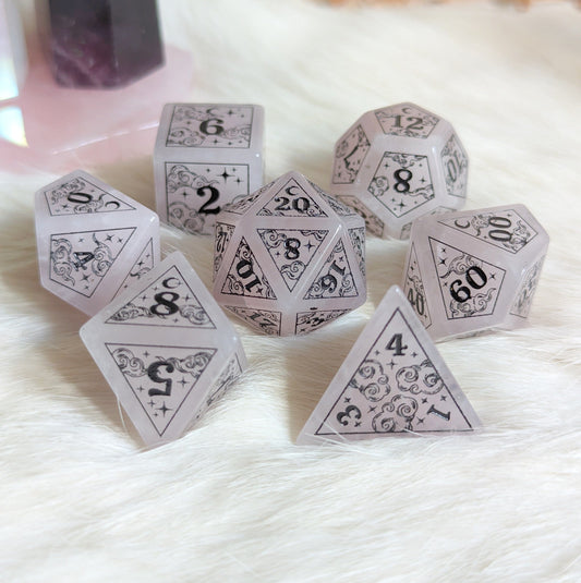 Rose Quartz Dice Set with cloud and moon design, perfect for magical Dungeons & Dragons games.