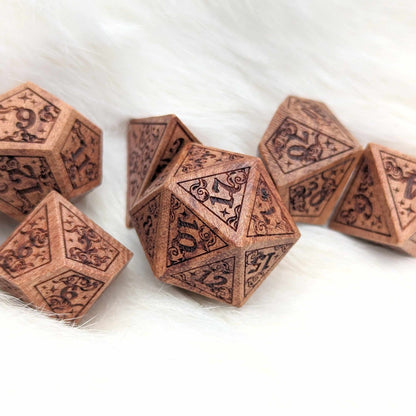 Dreamy Star and Moon Wood Dice Set with intricate engraved designs for Dungeons & Dragons on a soft white background.