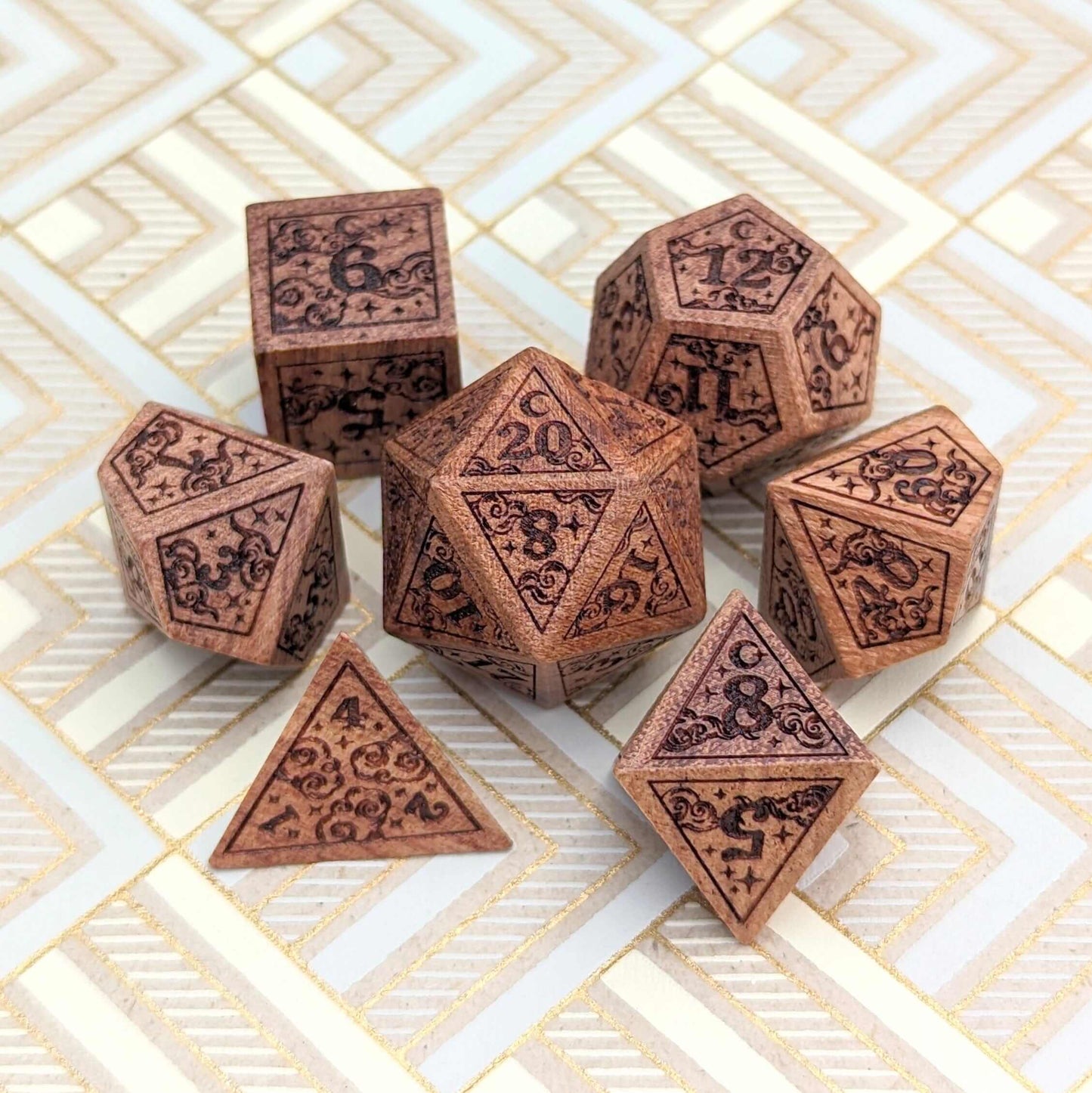 Dreamy Star and Moon wood dice set for Dungeons & Dragons featuring clouds, stars, and moons design on a patterned surface.