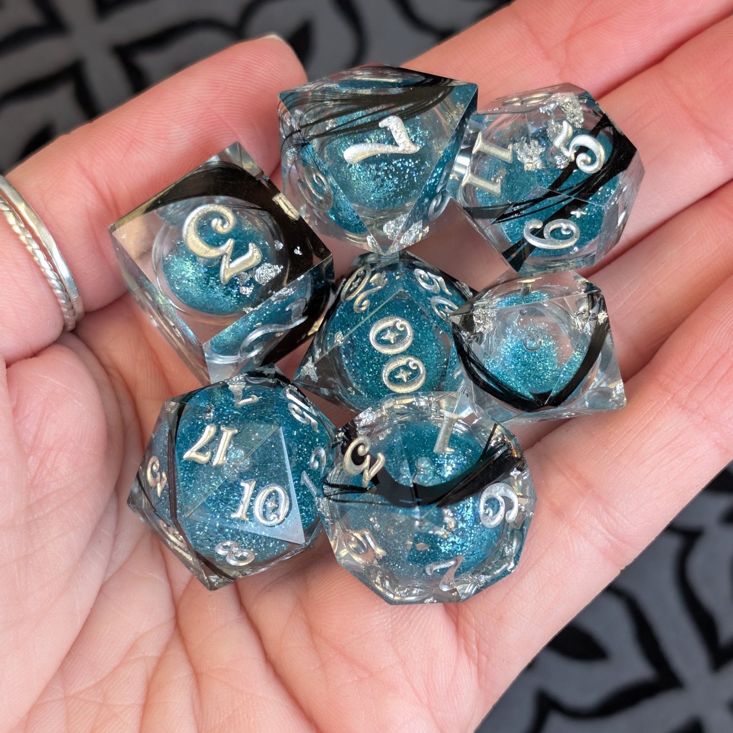 Feather Liquid Core Dice Set – 7pc Sharp Edge with Crystal D4 Dice Fennek and Finch