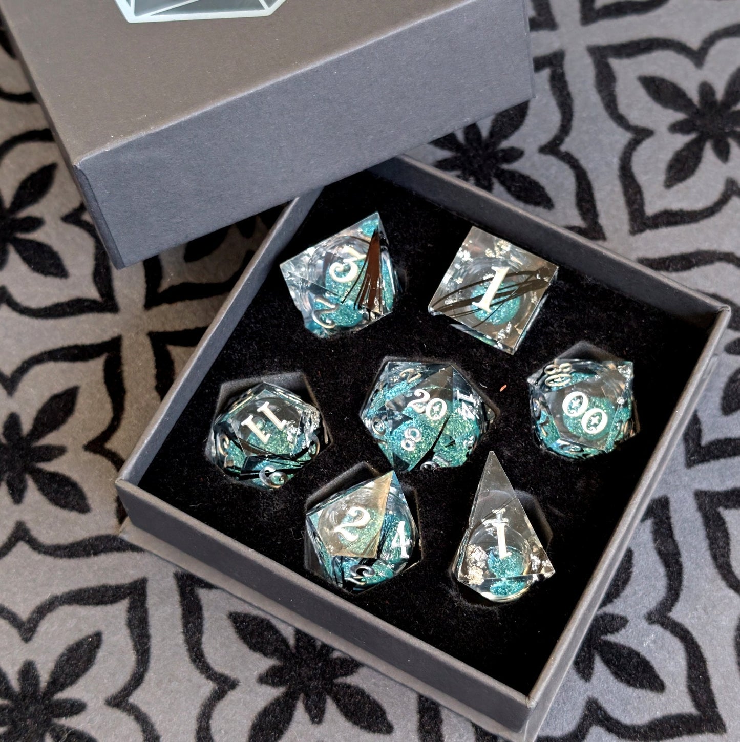Feather Liquid Core Dice Set – 7pc Sharp Edge with Crystal D4 Dice Fennek and Finch