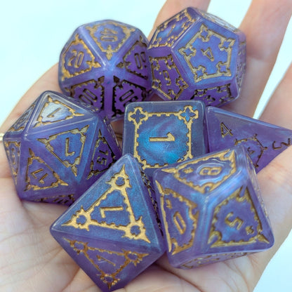 Extra large purple resin dice set with gold details in a hand, featuring a giant D20 and D6 from the Giant Castle Dice collection.