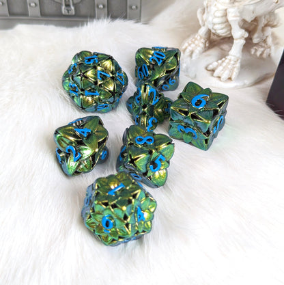 Green floral hollow metal dice set with 3D flower designs for tabletop gaming on white fur background.