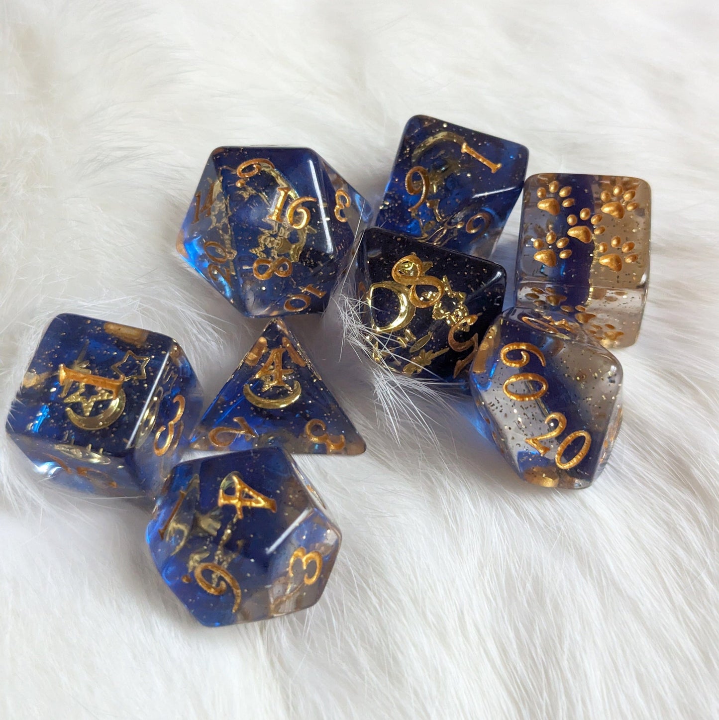 Moon and Stars Dice Set with glittering blue and gold resin, featuring gold numerals, for TTRPGs and Magic The Gathering.