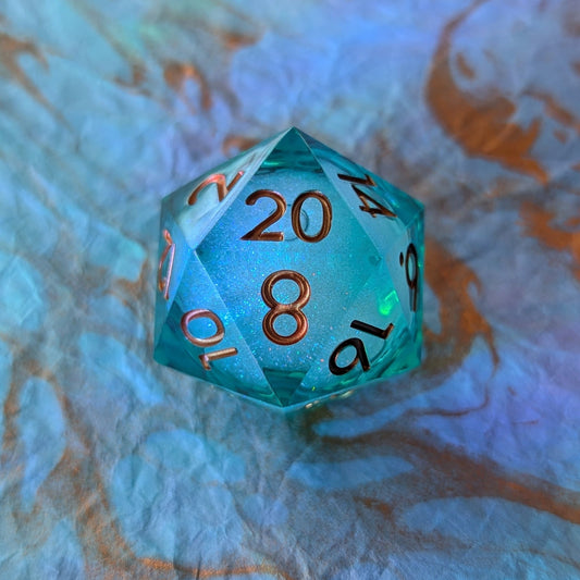 Ocean's Heart Liquid Core D20 – 1.5" Deep Blue Green Swirling Shimmer Die - Fennek and Finch
