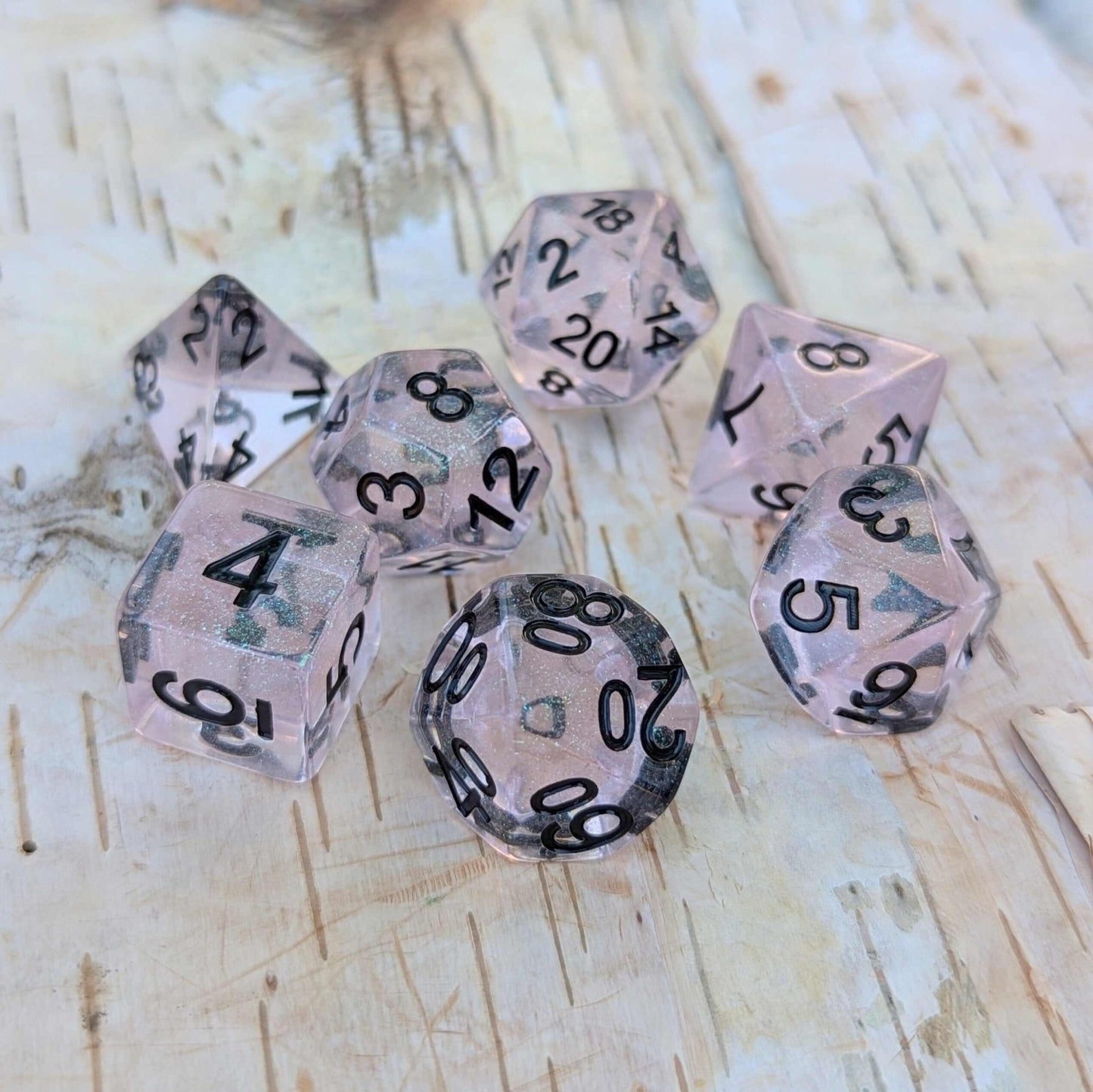Pink Stardust Dice Set – 7 - Piece Clear Pink Iridescent Glitter Black Font DnD - Fennek and Finch