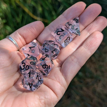 Pink Stardust Dice Set – 7 - Piece Clear Pink Iridescent Glitter Black Font DnD - Fennek and Finch