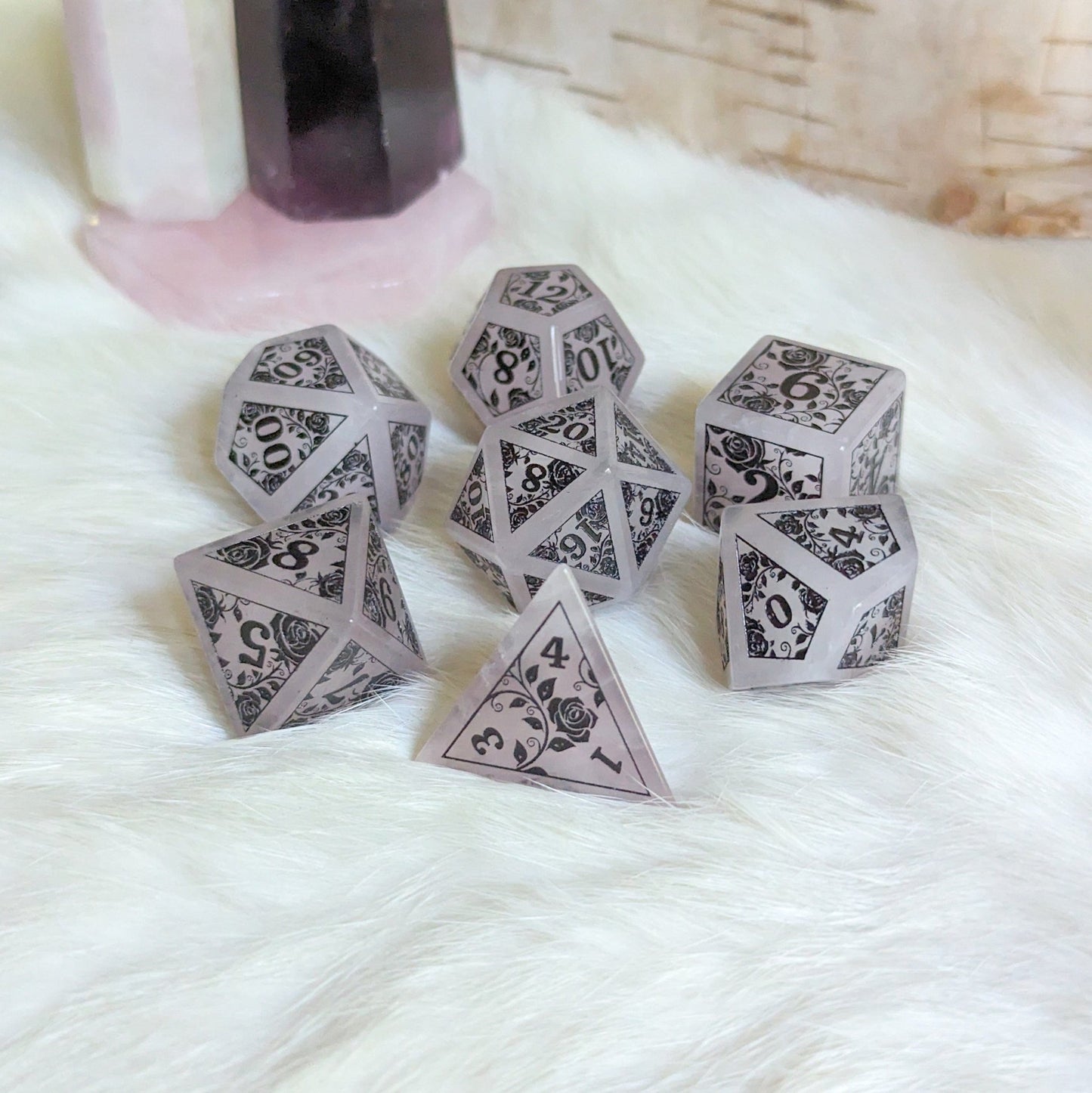 Roses on Quartz Dice Set – Rose Quartz Gemstone DnD Dice with Black Font | Fennek & Finch - Fennek and Finch