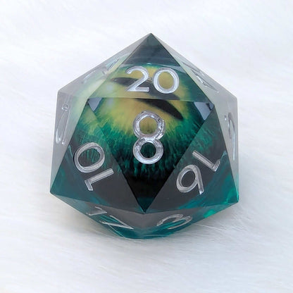 Large green D20 with vivid eye design inside, crafted from resin.