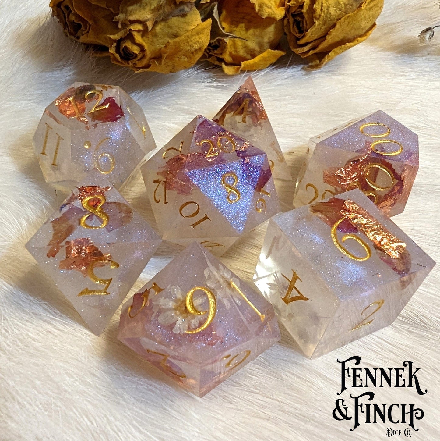 Fennek and Finch resin dice set with daisy flowers, rose petals, and purple blue shimmer for tabletop games like Dungeons and Dragons.