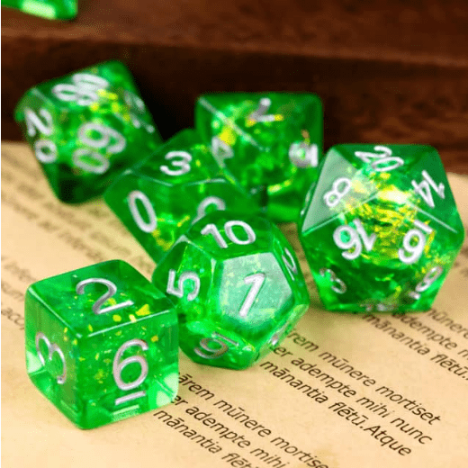 Green Apple Candy Crackle Dice Set with glitter for Dungeons & Dragons tabletop games, 7 polyhedral pieces on a book page.