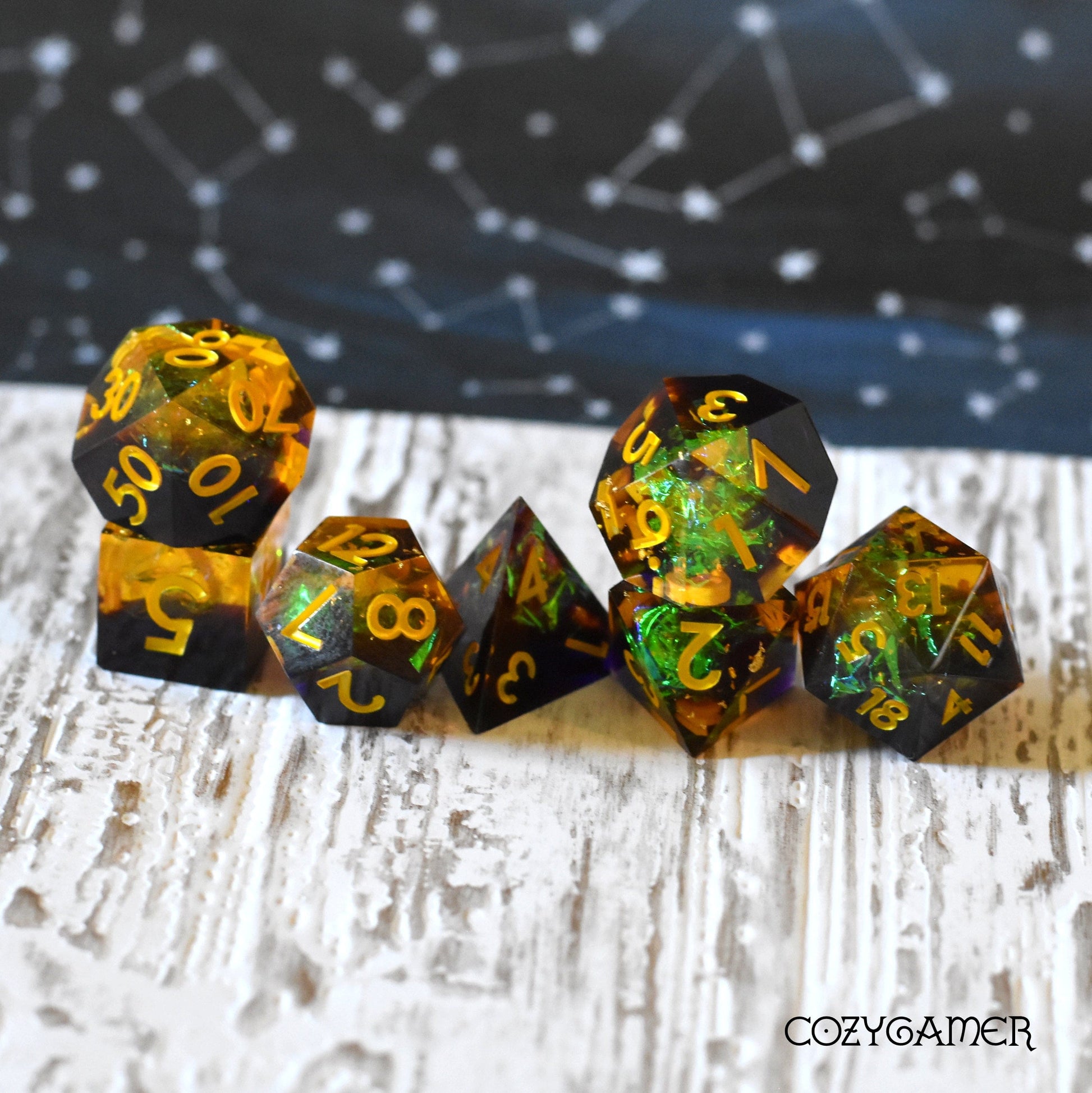 Autumn Magic Sharp Edge Resin Dice Set, black and yellow with glitter, 7 Piece polyhedral TTRPG dice for DND gaming.