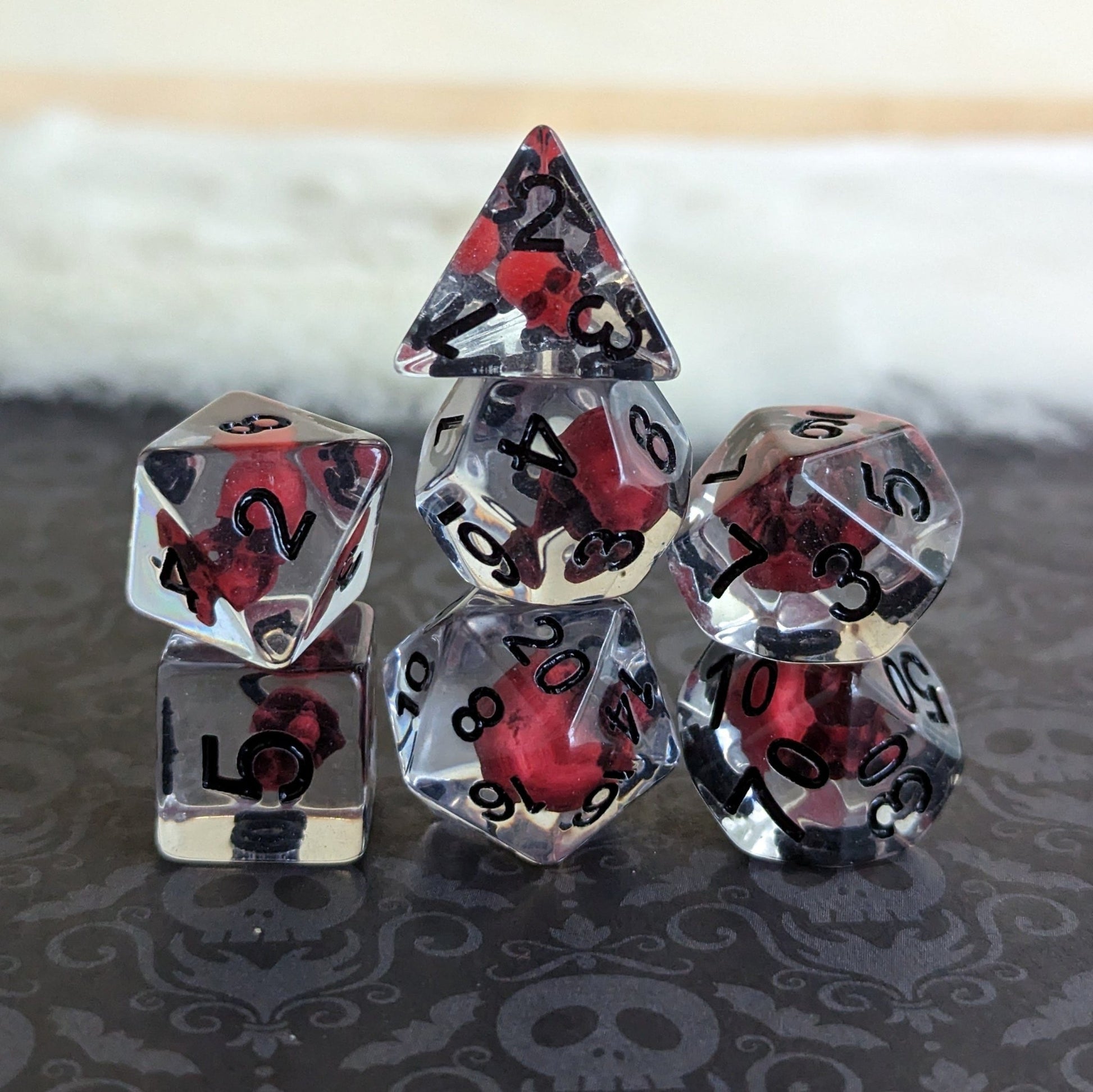 Blood Skull Dice Set – 7 - Piece Dark Red Skull Clear Resin DnD Dice - Fennek and Finch