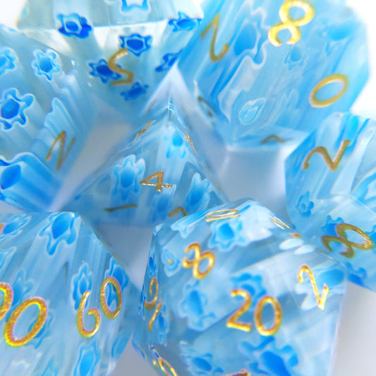 Blue Flower Glass DnD Dice Set with gold numbers, perfect for Dungeon Masters and D20 tabletop games. Unique and intricately crafted.