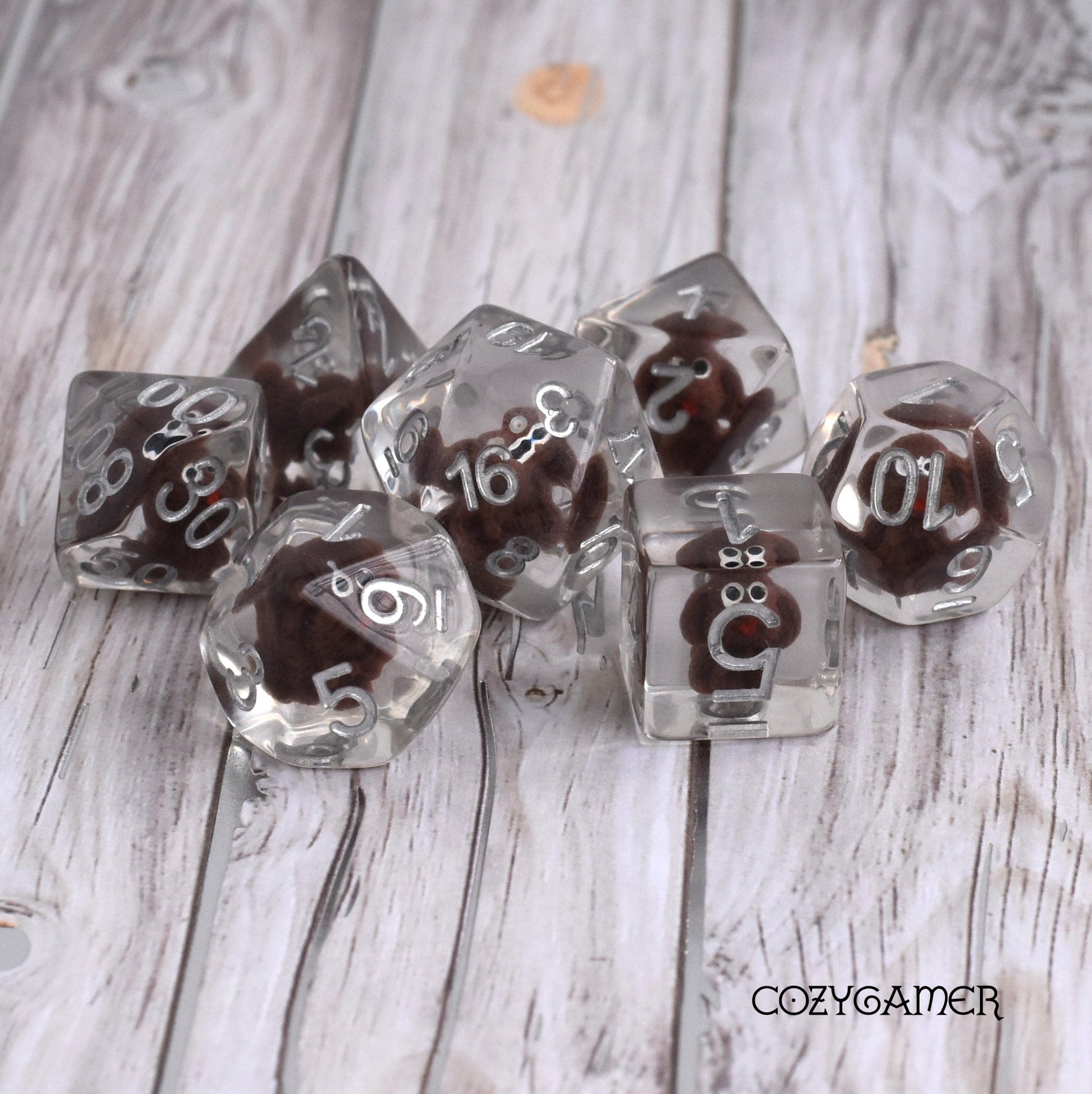 Brown Doggo Dice Set with tiny dogs inside clear resin, 7 polyhedral dice for Dungeons and Dragons, tabletop gaming accessories.