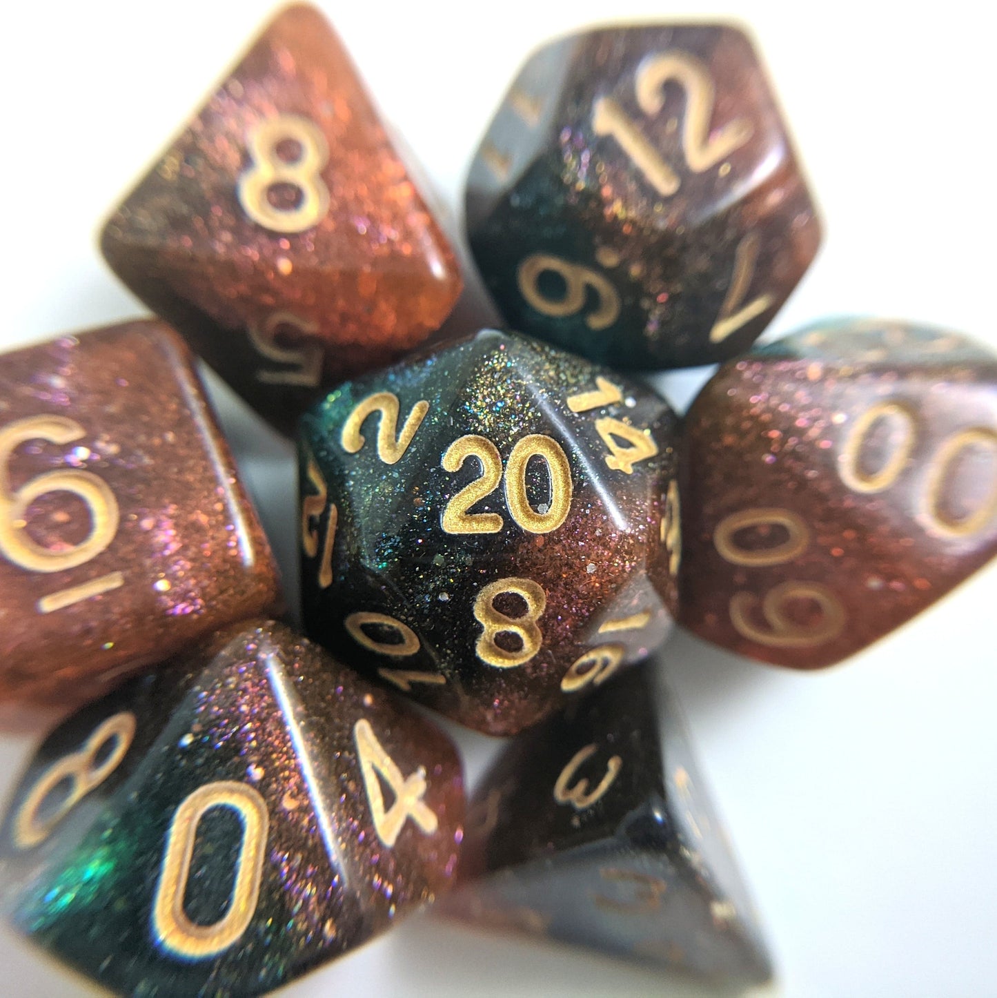 Carina Nebula Dice Set with orange and green marbling and micro shimmer for Dungeons & Dragons and TTRPGs, 7 polyhedral dice.