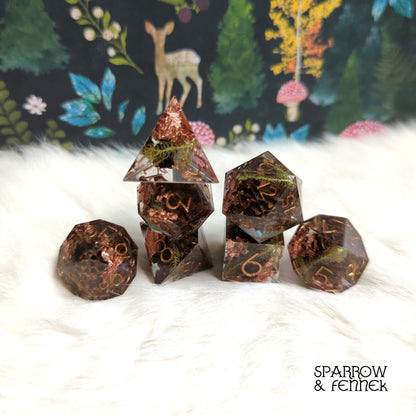 Casuarina - Seeds of Change Sharp Edge Resin Dice Set. 7 Piece DND dice set with real dried fruit inside