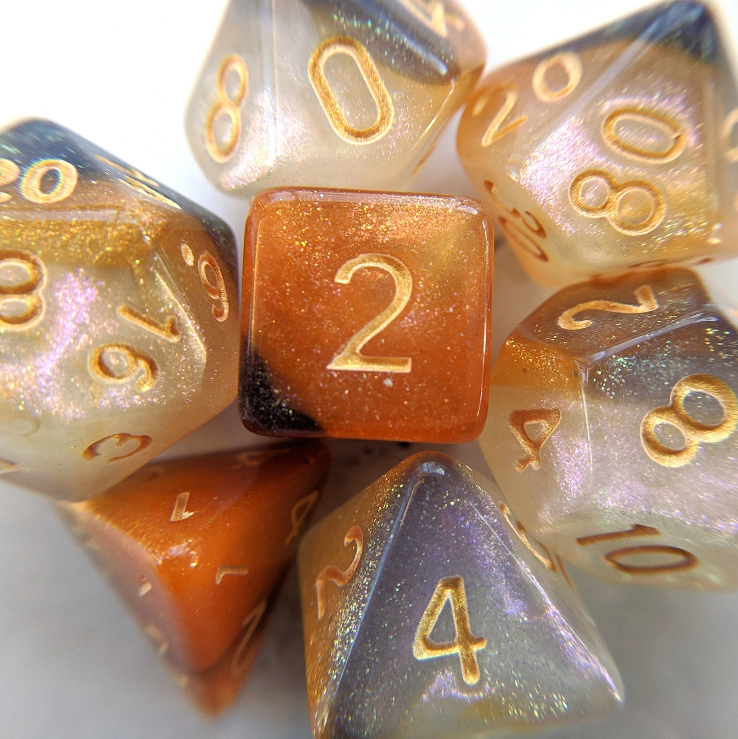 Cat Claws Dice Set with orange, white, and black marbled shimmer, ideal for Dungeons & Dragons and TTRPG enthusiasts.