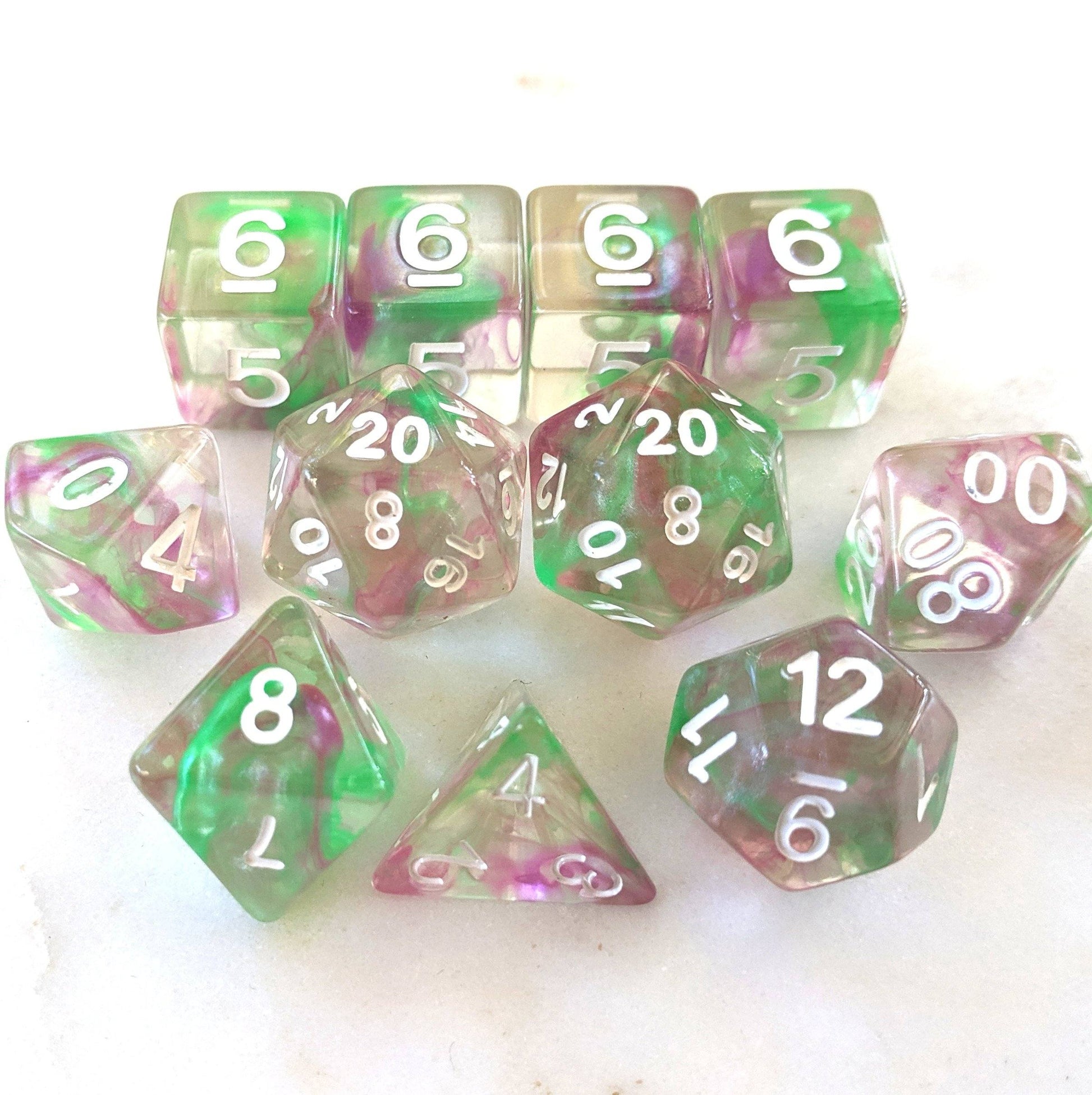 11 Piece Dice Set. Clear Resin with Purple and Green - CozyGamer