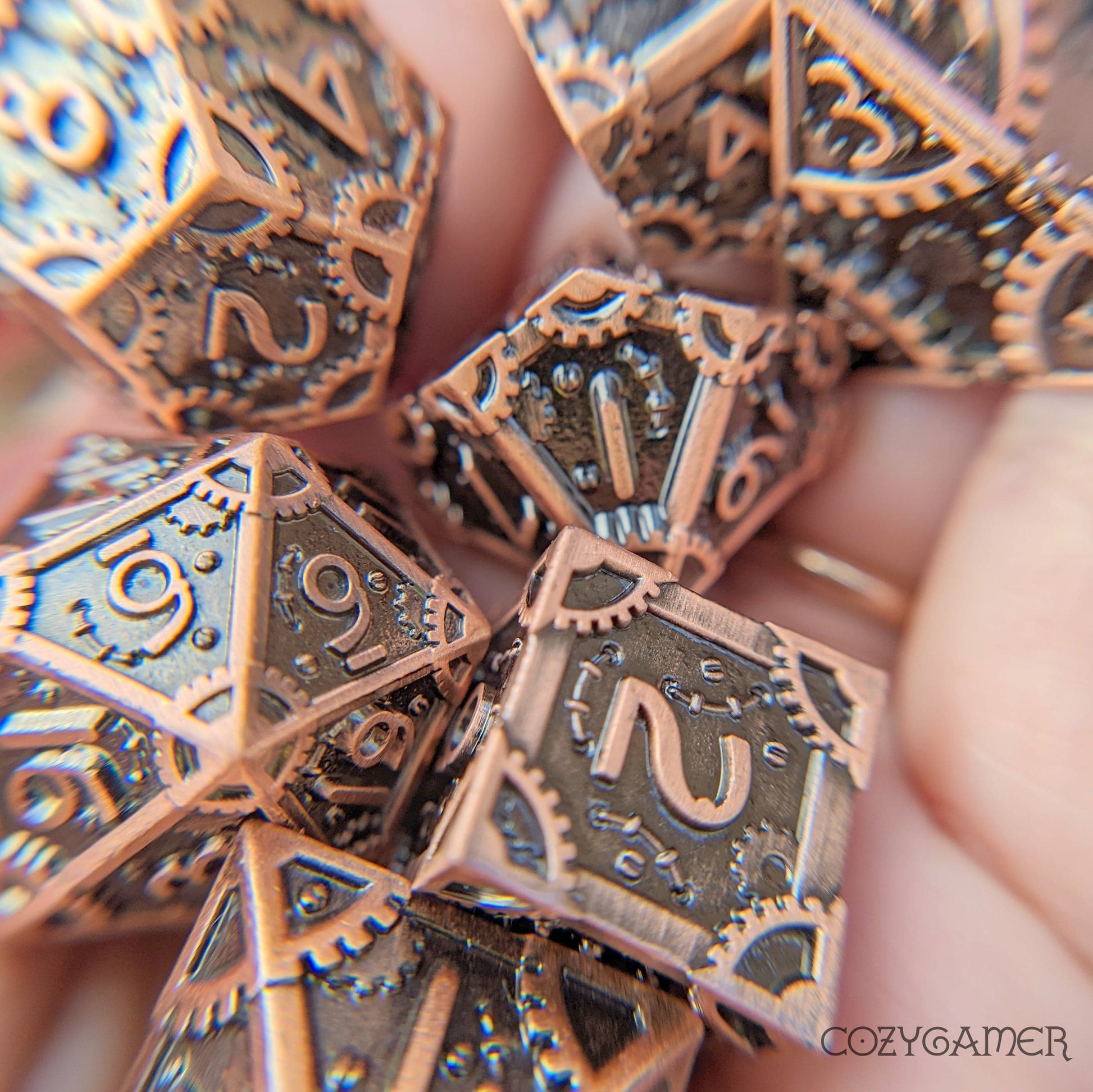 Copper metal gear dice set with clockwork design, includes 7 polyhedral dice for RPGs like Dungeons and Dragons.