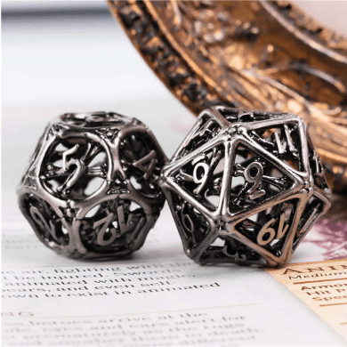 Cross Bones Hollow Metal Dice Set on tabletop RPG book