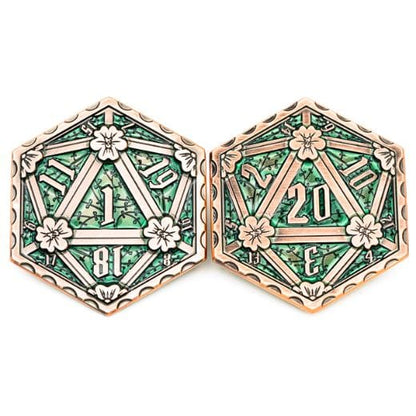 Hexagonal D20 emerald metal coin with floral design, zinc alloy, two-sided die showing 1 and 20 numbers, green enamel.