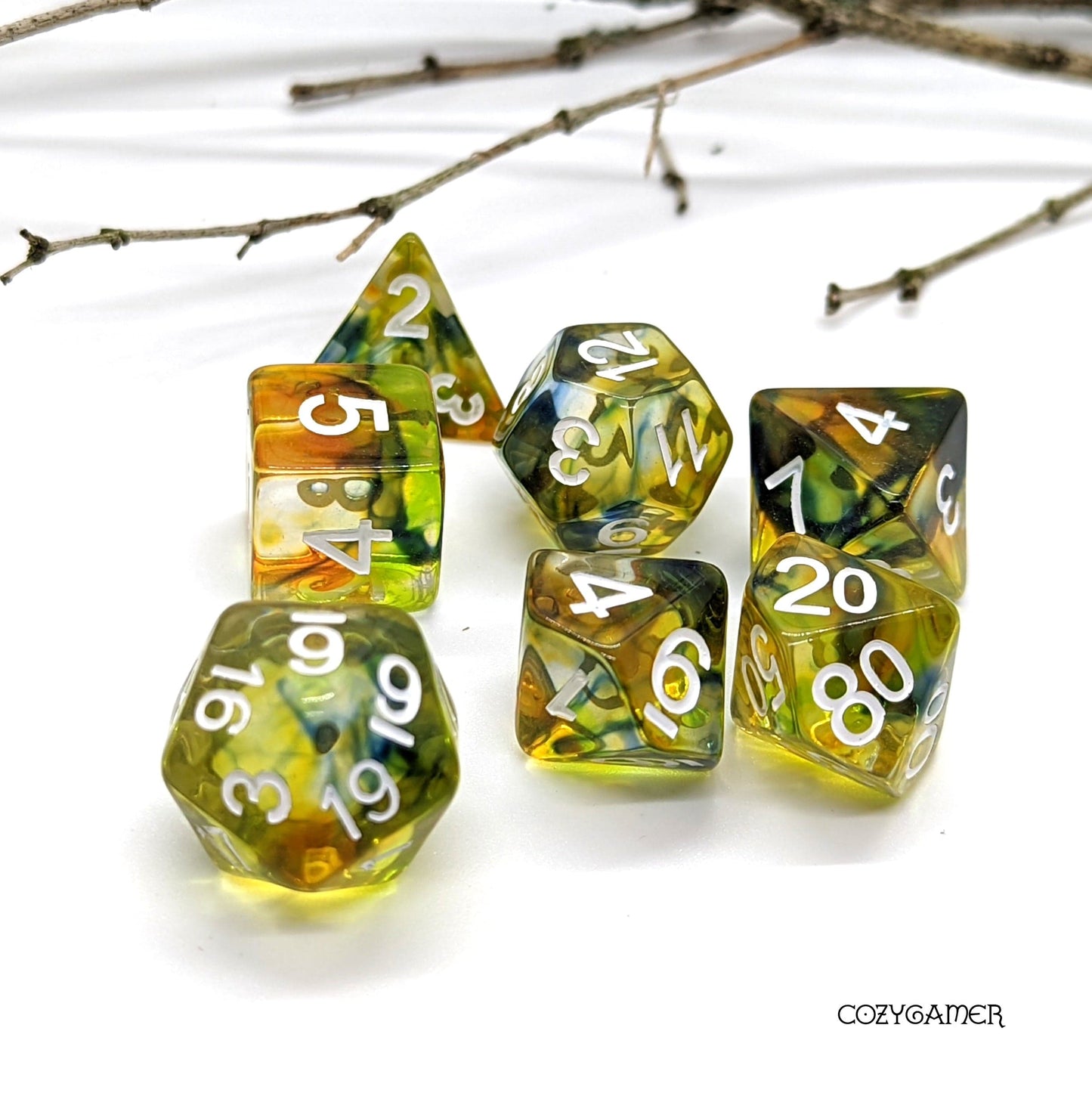 Earthen Caster Dice Set with green swirling ink in clear resin for DnD, 7 piece polyhedral dice for tabletop RPGs.